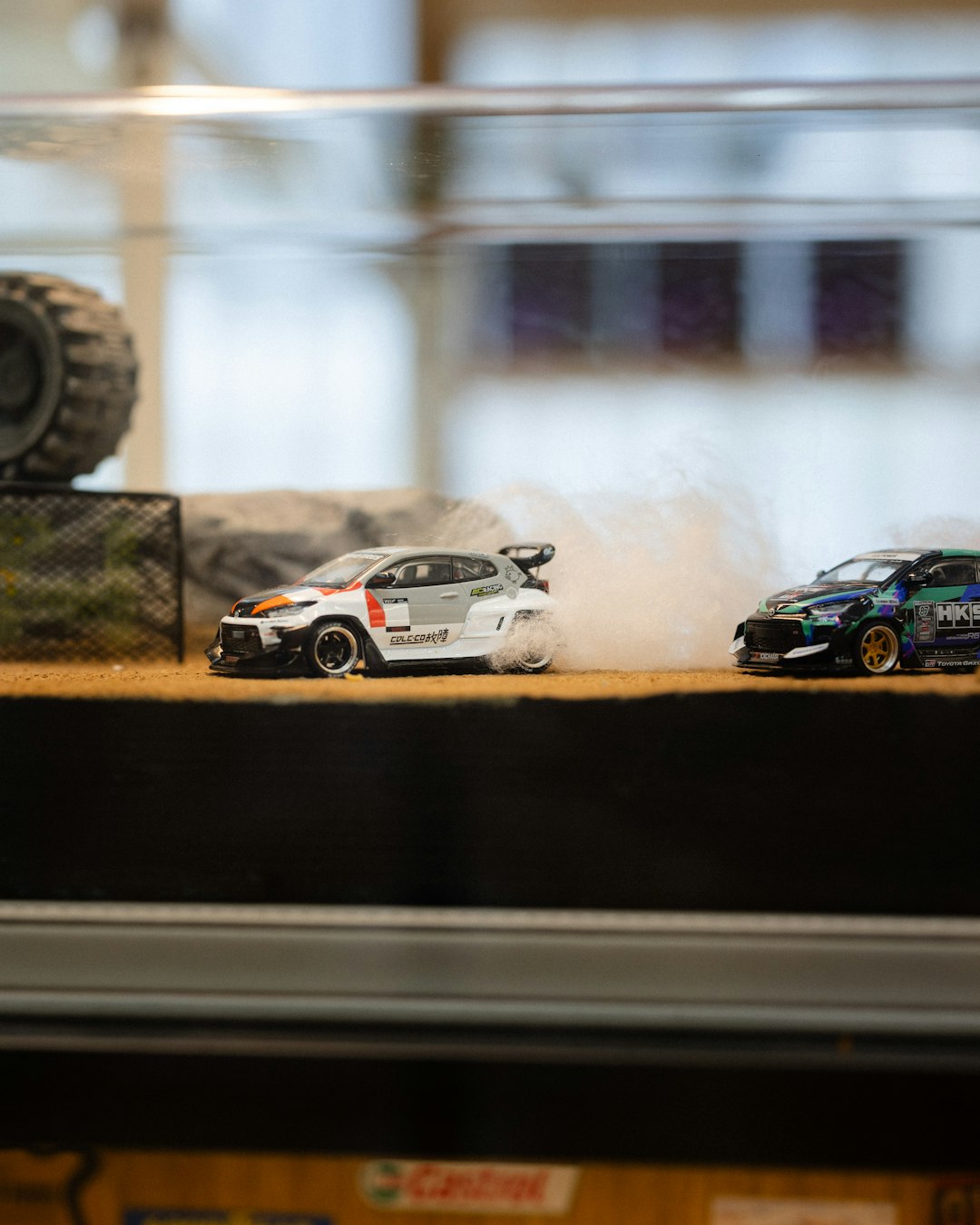 A high-speed RC drift car and an electric mosquito racket side by side, showcasing top must-have student gifts under ₹2000.